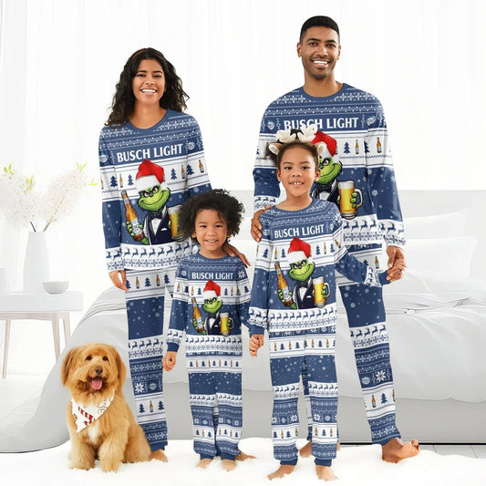 Family of four wearing matching blue Busch Light Christmas pajamas with Grinch and beer design, standing barefoot indoors with a dog
