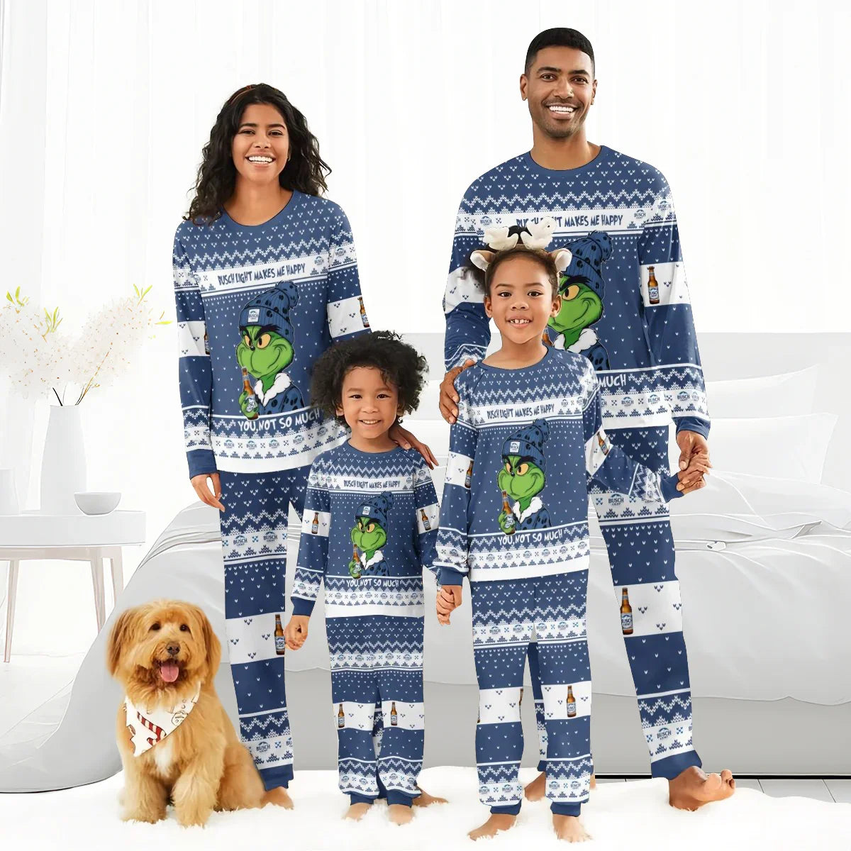 Smiling family and dog in matching blue Grinch-themed Busch Light holiday pajamas in bright white room