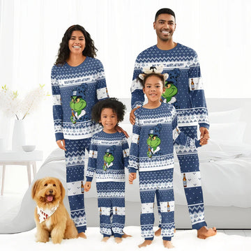 Smiling family and dog in matching blue Grinch-themed Busch Light holiday pajamas in bright white room