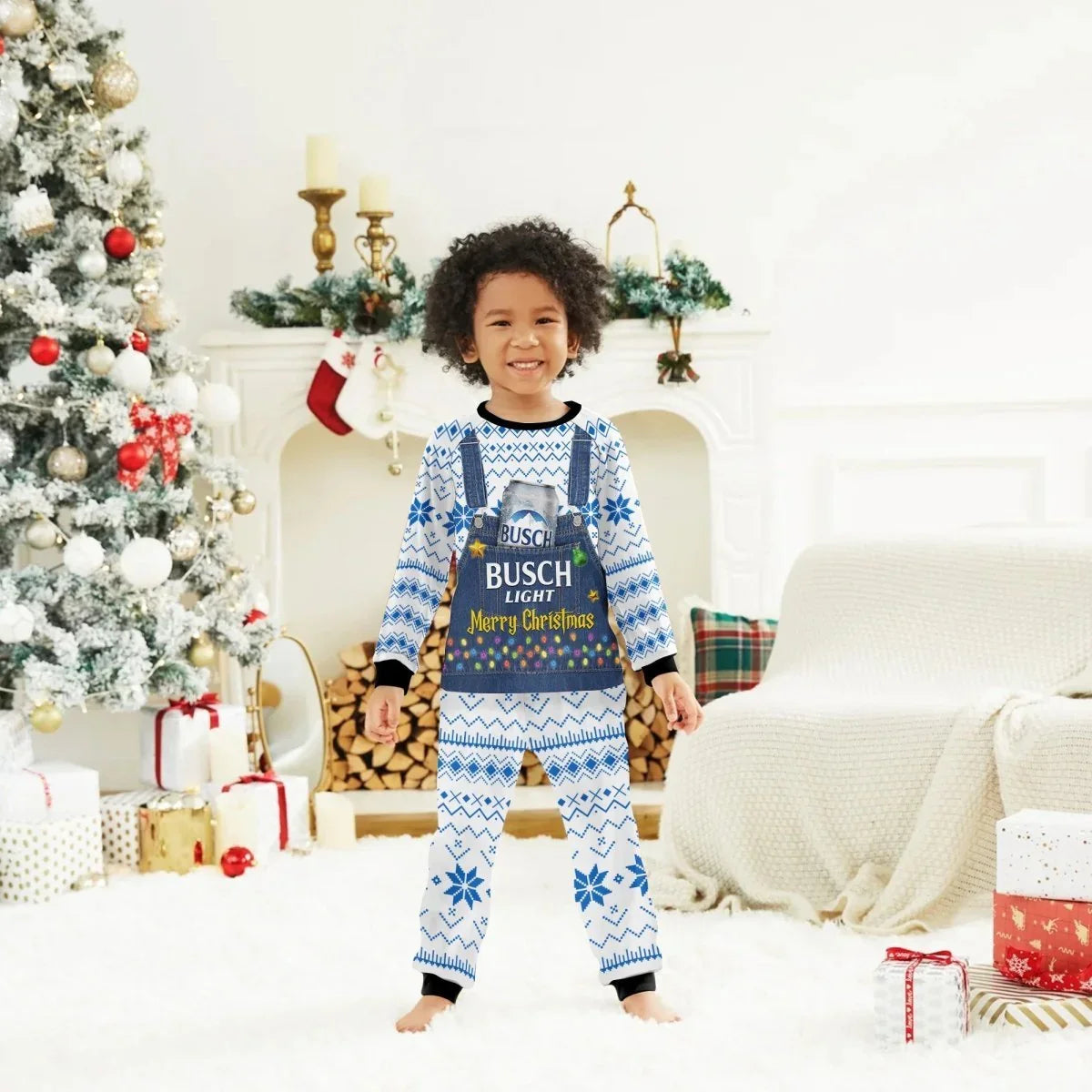 Smiling child in blue and white Busch Light Merry Christmas pajamas standing in decorated living room with Christmas tree and gifts