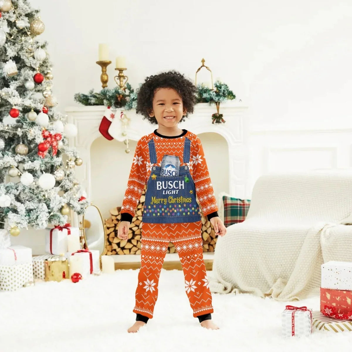 Smiling child in orange Busch Light Merry Christmas pajamas in festive living room with decorated tree and gifts