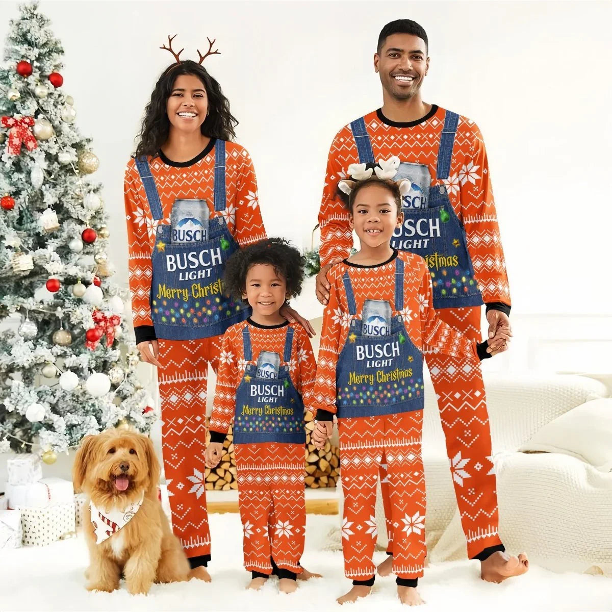 Family of four in matching orange Busch Light Merry Christmas pajamas with reindeer headbands by decorated tree and dog