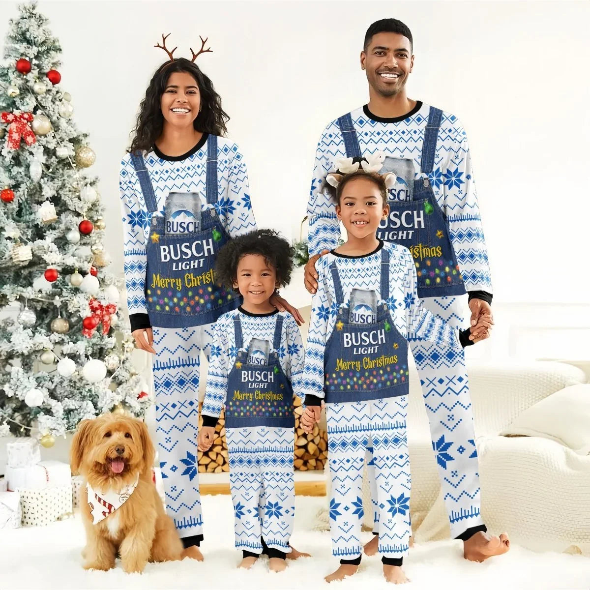 Smiling family in matching Busch Light Merry Christmas pajamas by decorated Christmas tree with dog
