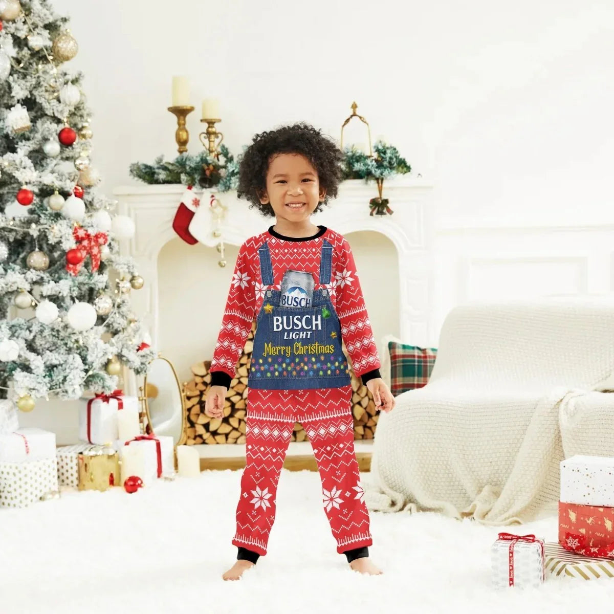 Smiling child in red Busch Light Merry Christmas pajamas in festive living room with Christmas tree