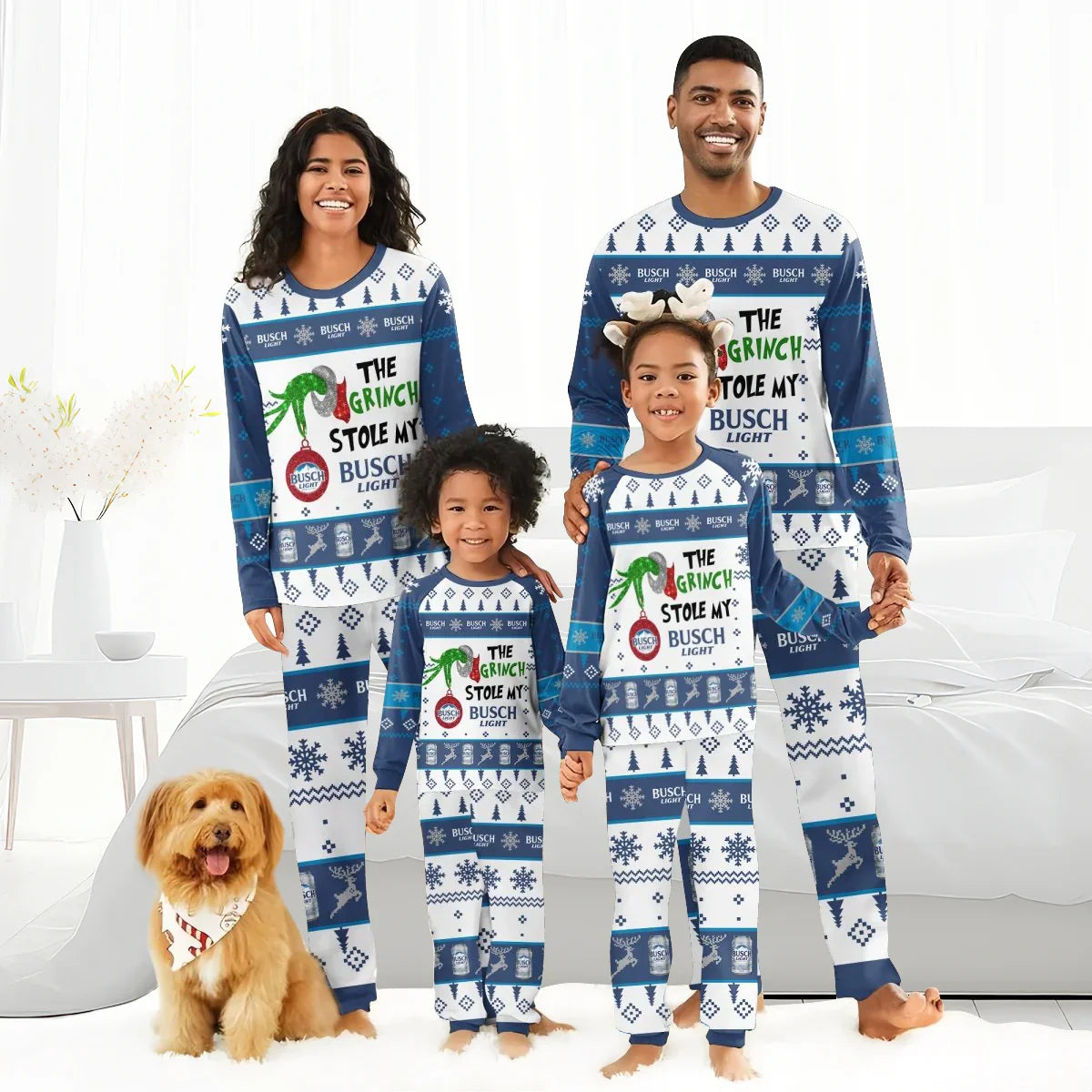 Smiling family in matching blue and white Busch Light Christmas pajamas with Grinch theme, indoors with dog
