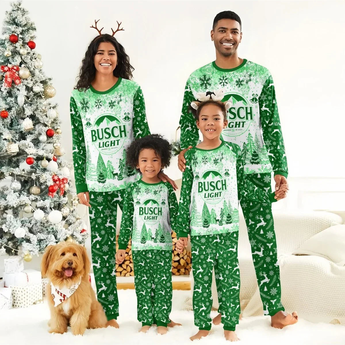 Smiling family in green Busch Light Christmas pajamas and festive headbands by decorated Christmas tree with dog