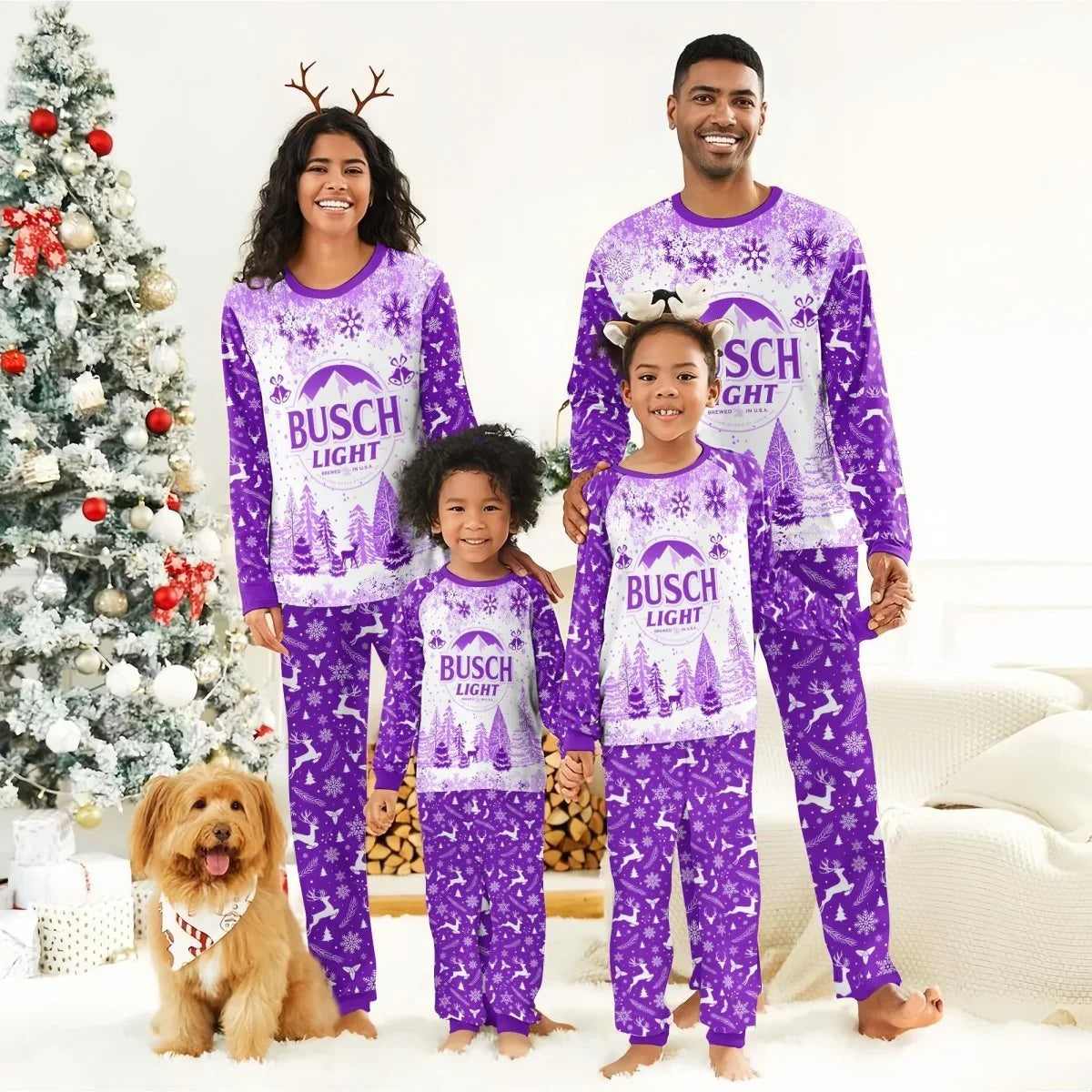 Smiling family in matching purple Busch Light Christmas pajamas with snowflakes and reindeer near decorated Christmas tree with dog