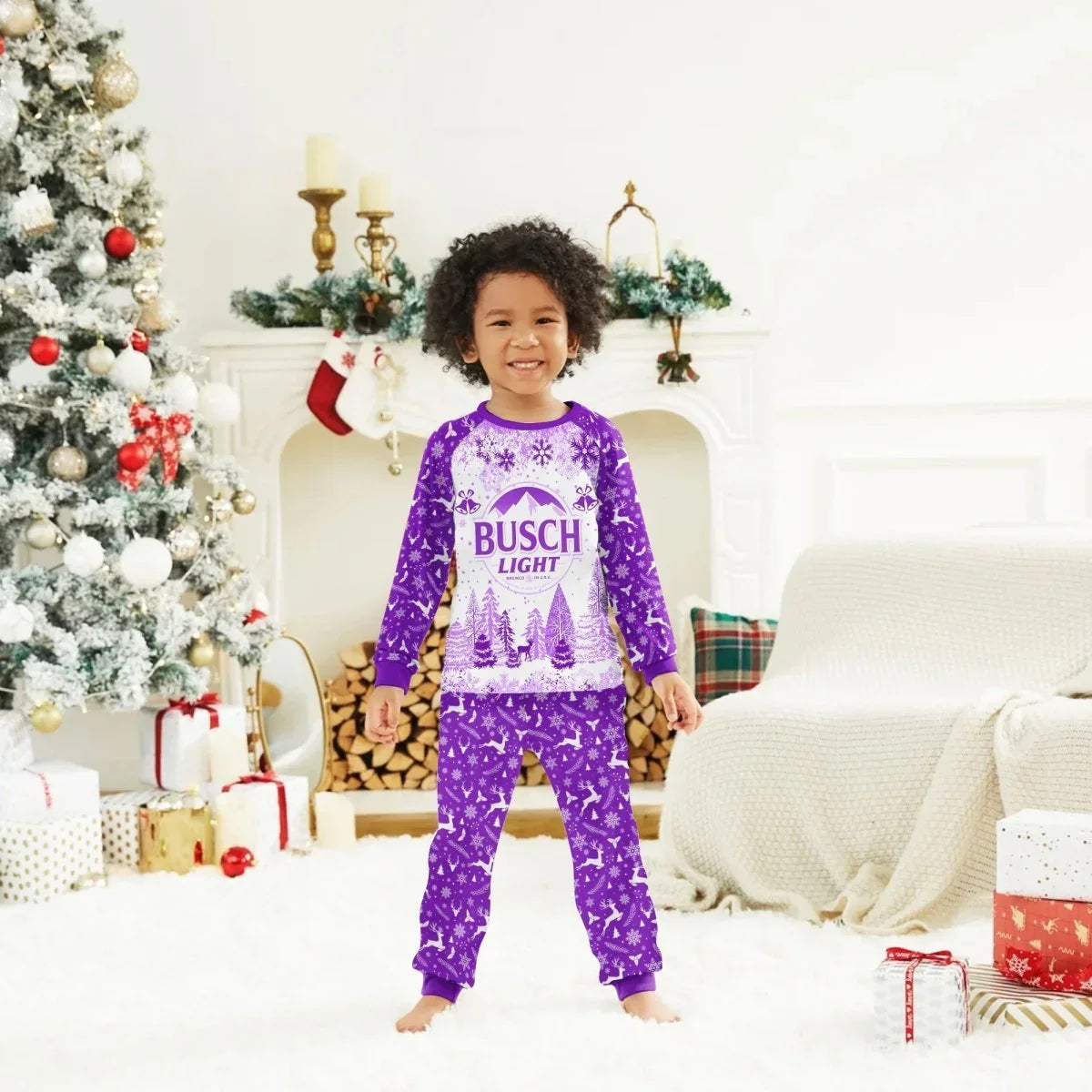Smiling child in purple Busch Light holiday pajamas standing in festive living room with Christmas tree and gifts