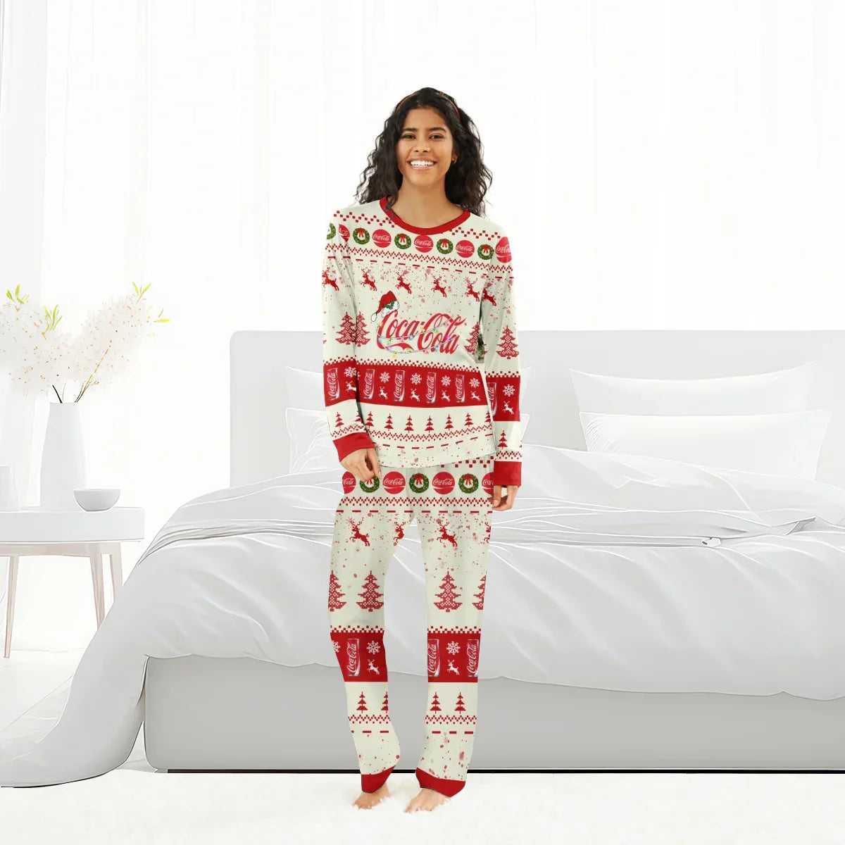 Smiling woman wearing Coca-Cola Christmas reindeer family pajamas in white and red patterns