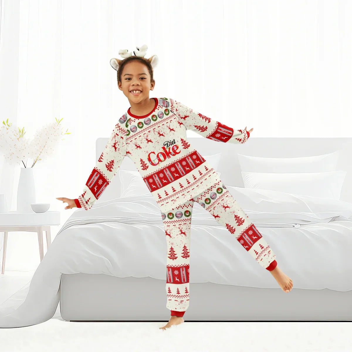 Child wearing festive Diet Coke Christmas pajamas with reindeer and holiday patterns in bright bedroom