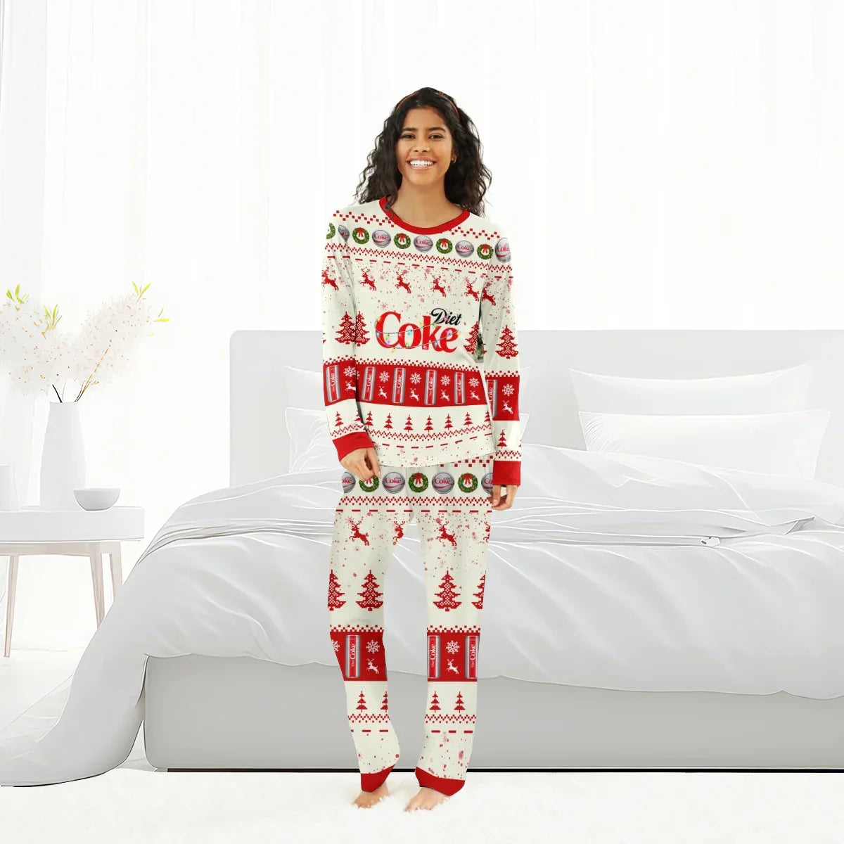 Smiling woman wearing red and white Diet Coke Christmas reindeer family pajamas in bright bedroom