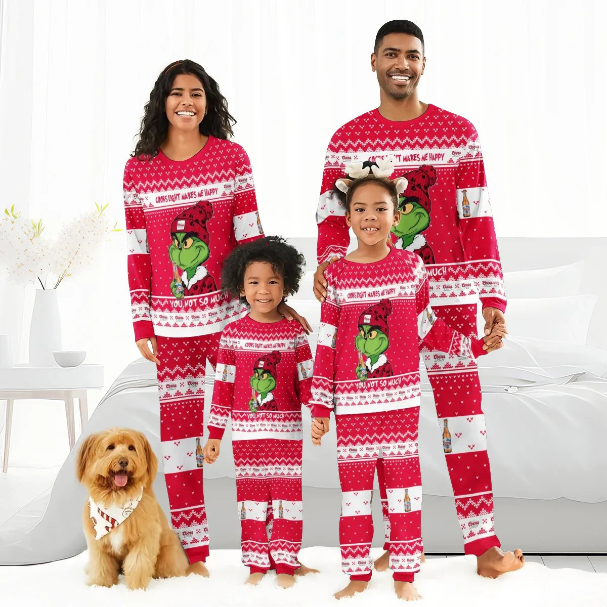 Smiling family of four wearing matching red Grinch and Coors Light holiday pajamas with a small dog indoors