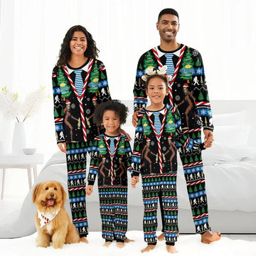 Happy family in matching Corona Extra Christmas Bigfoot pajamas with dog in festive bandana in bright bedroom
