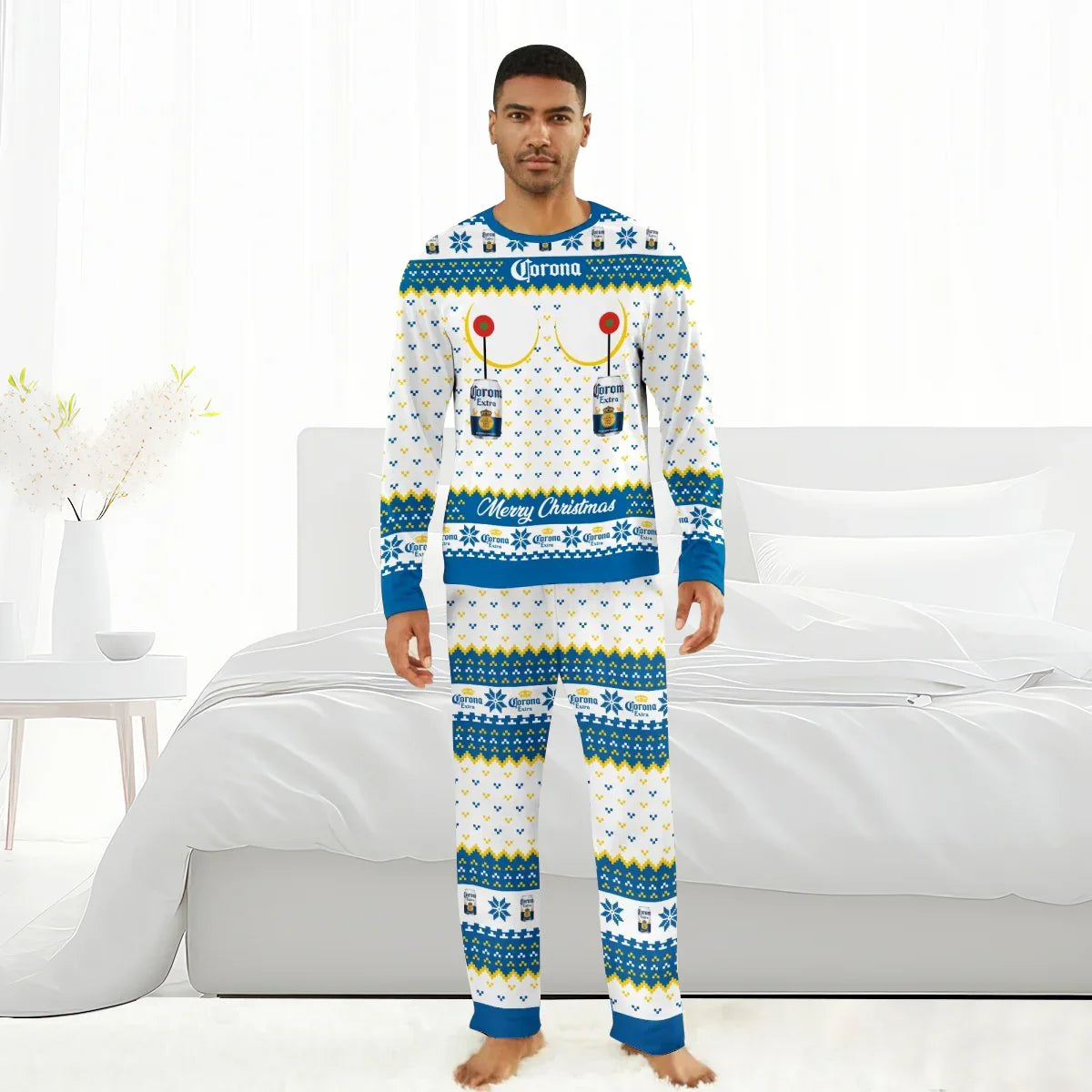 Man wearing Corona Extra Merry Christmas holiday-themed pajamas standing barefoot in a bright bedroom