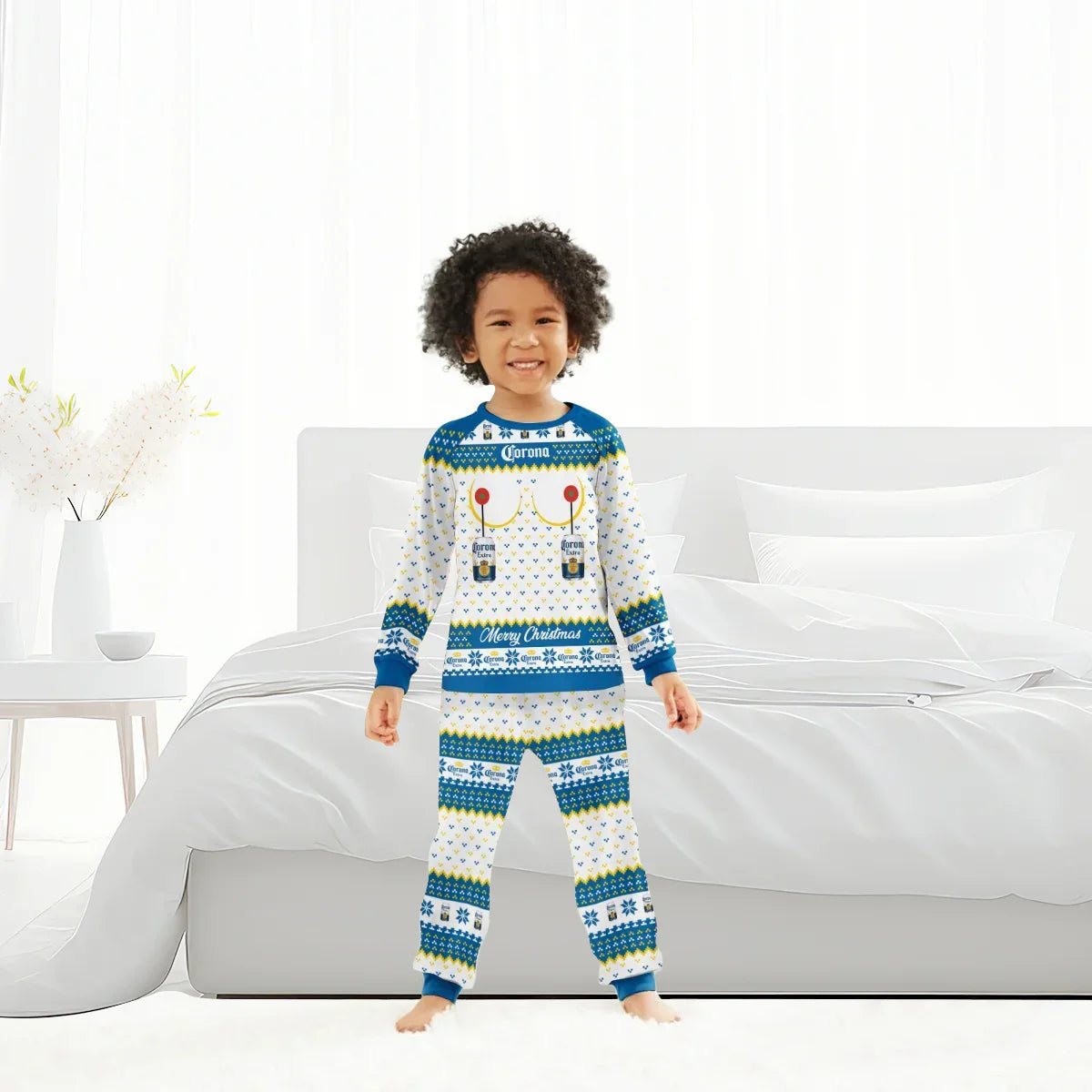 Smiling child wearing Corona Extra Merry Christmas family pajamas in bright bedroom
