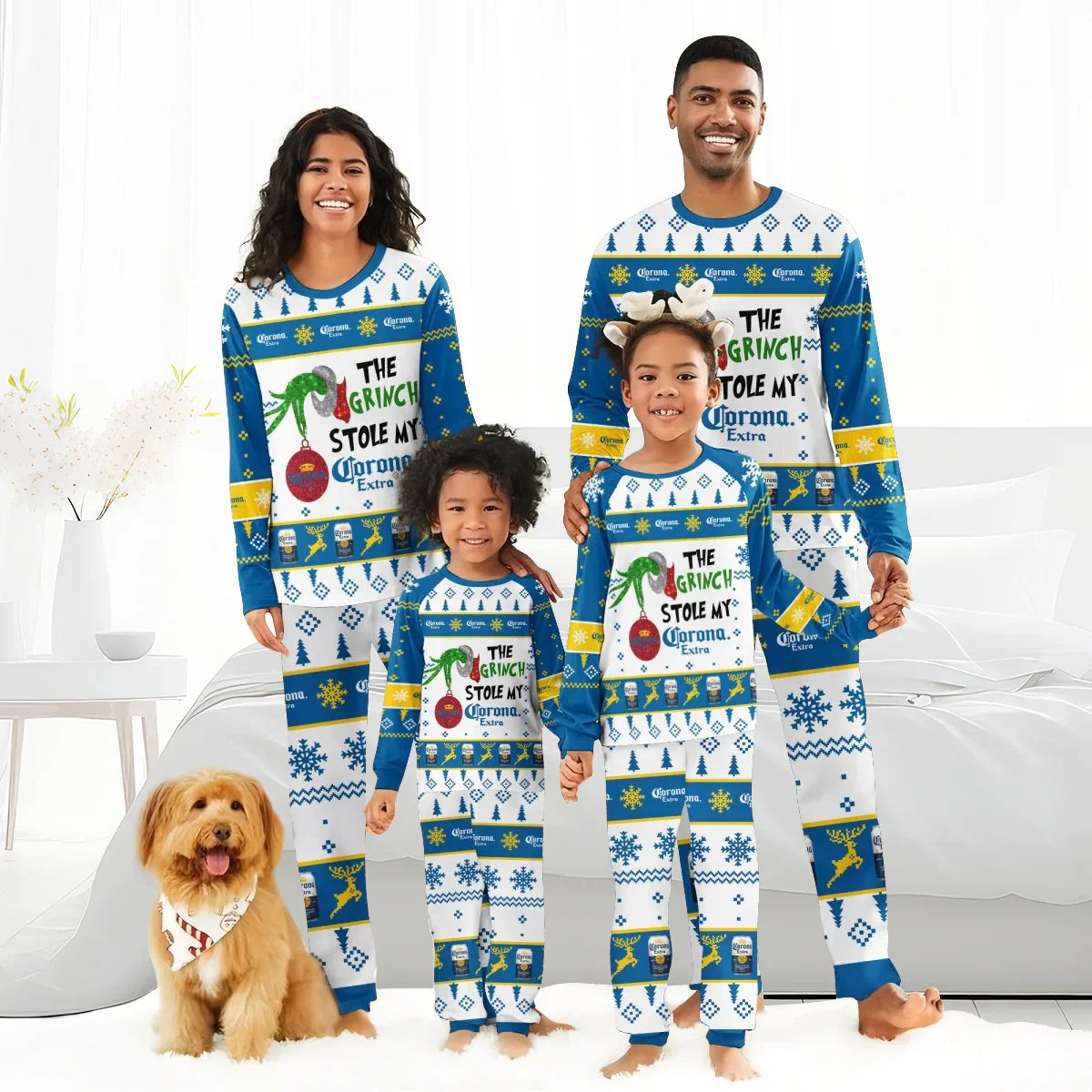 Smiling family in matching blue and white Christmas pajamas with Corona Extra and Grinch design, smiling dog with bandana