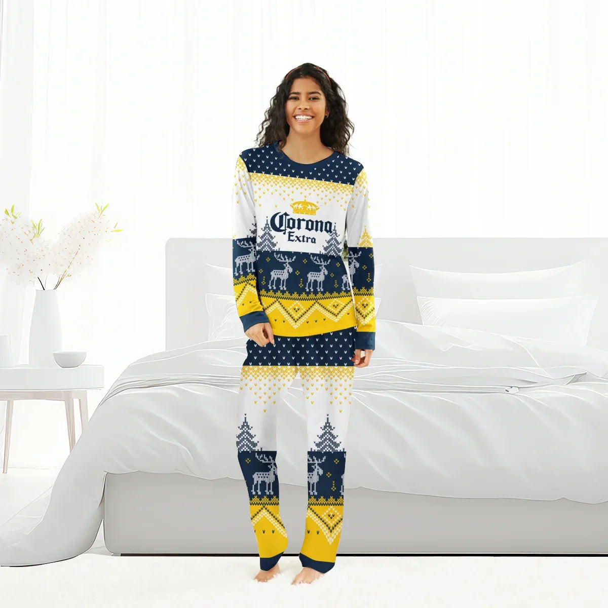Smiling woman in Corona Extra winter reindeer family pajamas standing in bright modern bedroom