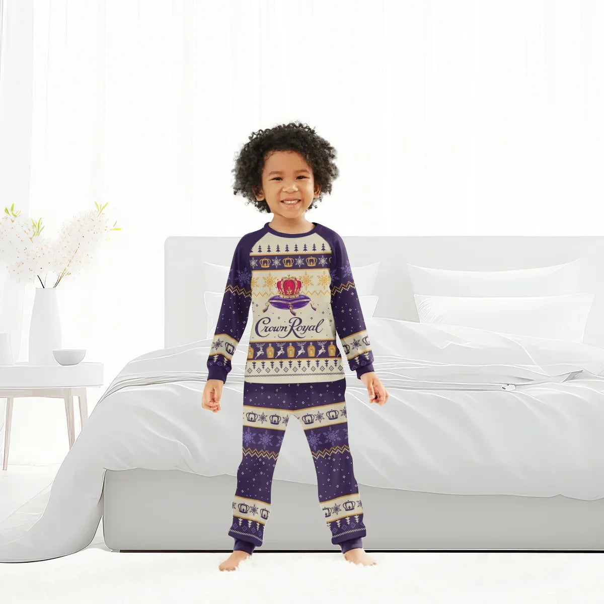 Smiling child in Crown Royal Christmas family pajamas set standing in bright bedroom