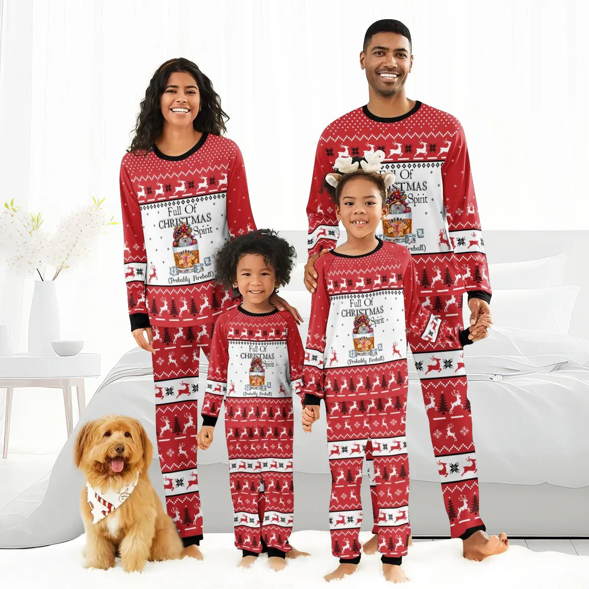 Smiling family and dog in red matching Christmas pajamas with Fireball whiskey holiday design
