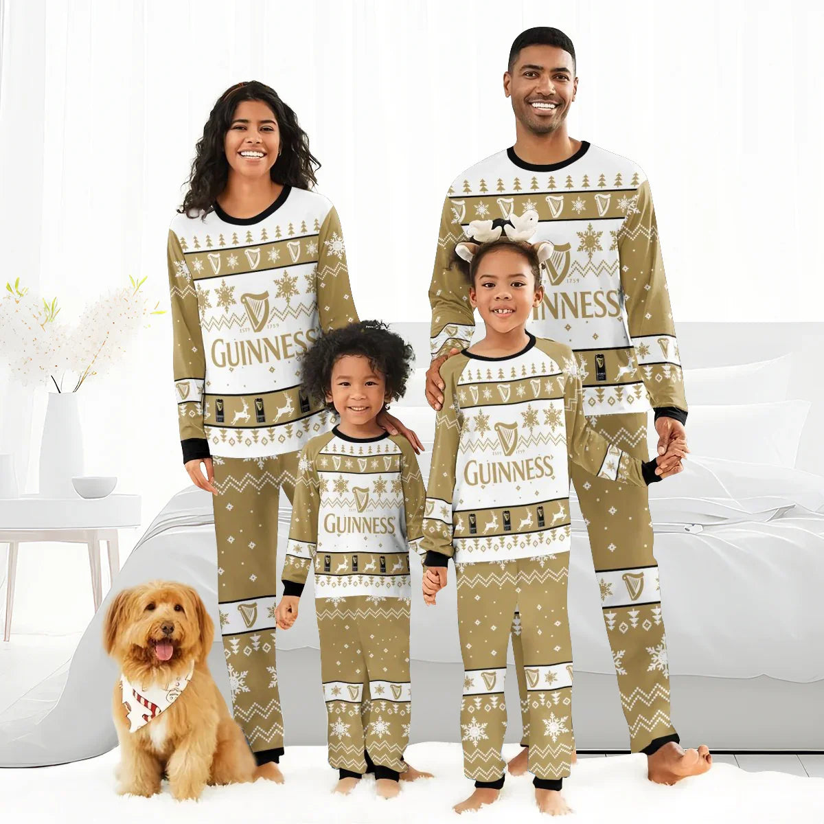 Smiling family in matching gold and white Guinness Christmas holiday pajamas in bright bedroom with dog