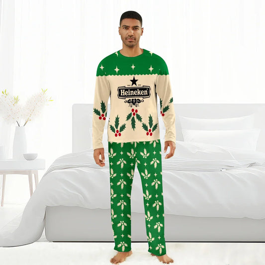 Man wearing Heineken Christmas-themed green and cream holiday pajamas with holly and star patterns in a bright bedroom