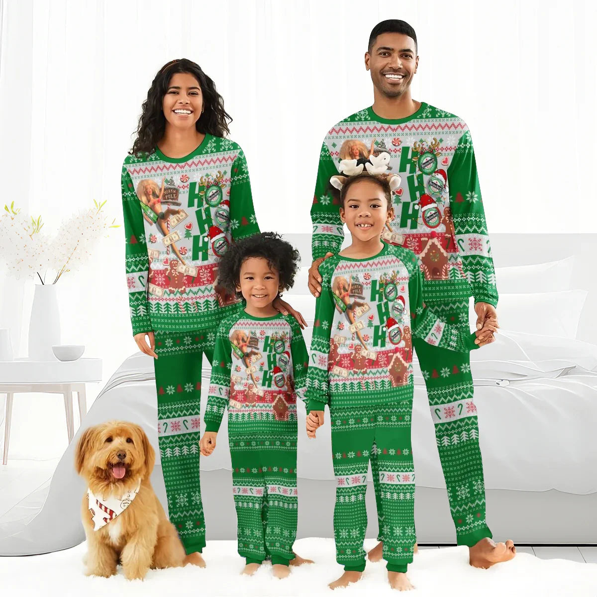 Smiling family in matching green Christmas pajamas with Ho Ho Ho print, posing barefoot with dog in bright bedroom