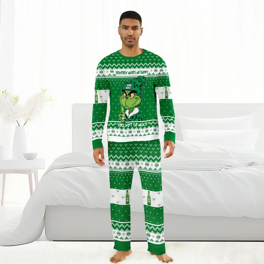 Man wearing green Heineken Grinch themed Christmas pajamas with text and beer bottle patterns
