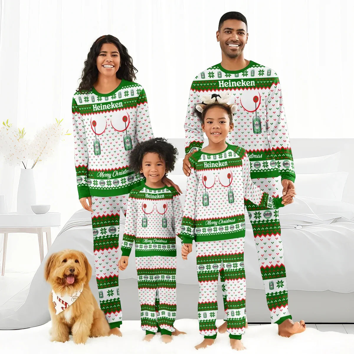 Family of four in matching Heineken Christmas pajamas posing in bright bedroom with a dog