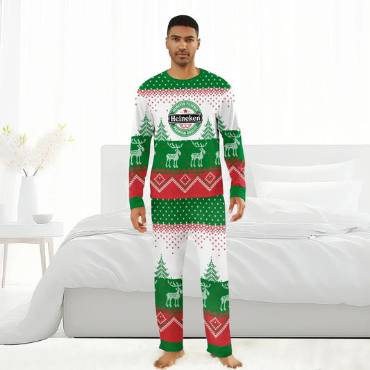 Man wearing Heineken branded Christmas pajamas with reindeer and tree patterns in bedroom