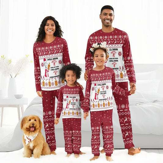 Smiling family in matching red Christmas Fireball-themed pajamas with snowflakes and reindeer, posing in bedroom