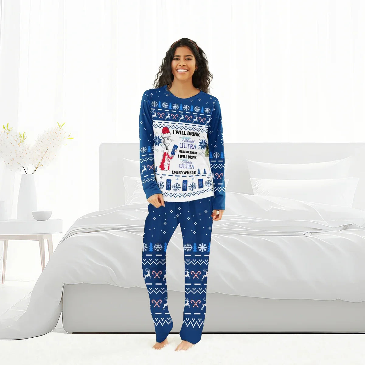 Woman in blue Christmas pajamas with Michelob Ultra holiday beer design in bright bedroom