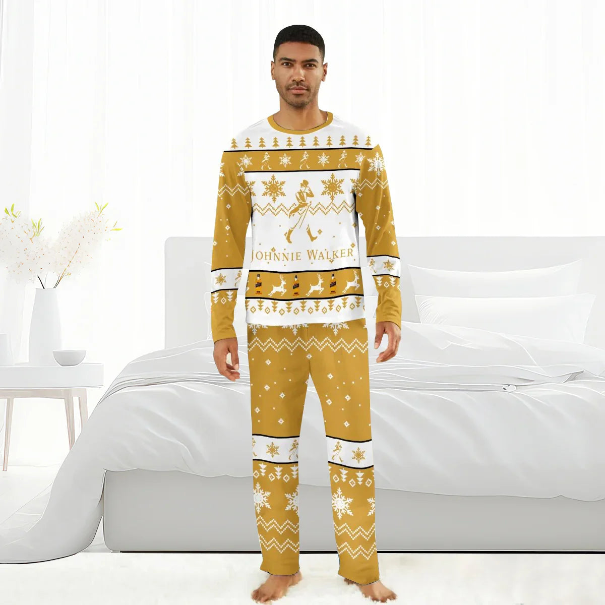Man wearing gold and white Johnnie Walker Christmas family pajamas in festive bedroom setting