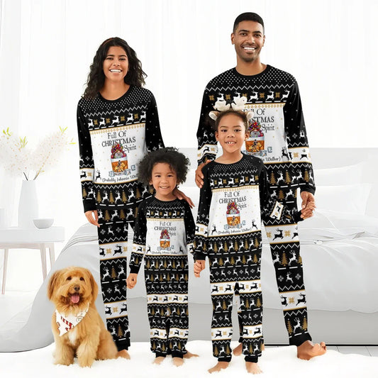 Family of four wearing matching black Christmas pajamas with reindeer, trees, and 'Full of Christmas Spirit' text, dog included