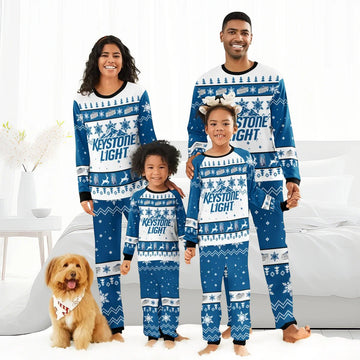Family of four in matching Keystone Light blue and white Christmas pajamas with snowflakes and reindeer, dog with bandana