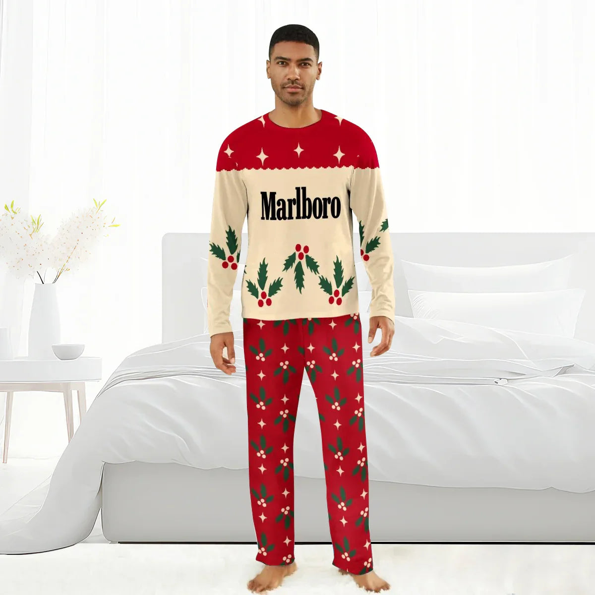Man wearing Marlboro branded Christmas cherry family pajamas in bedroom with white bedding