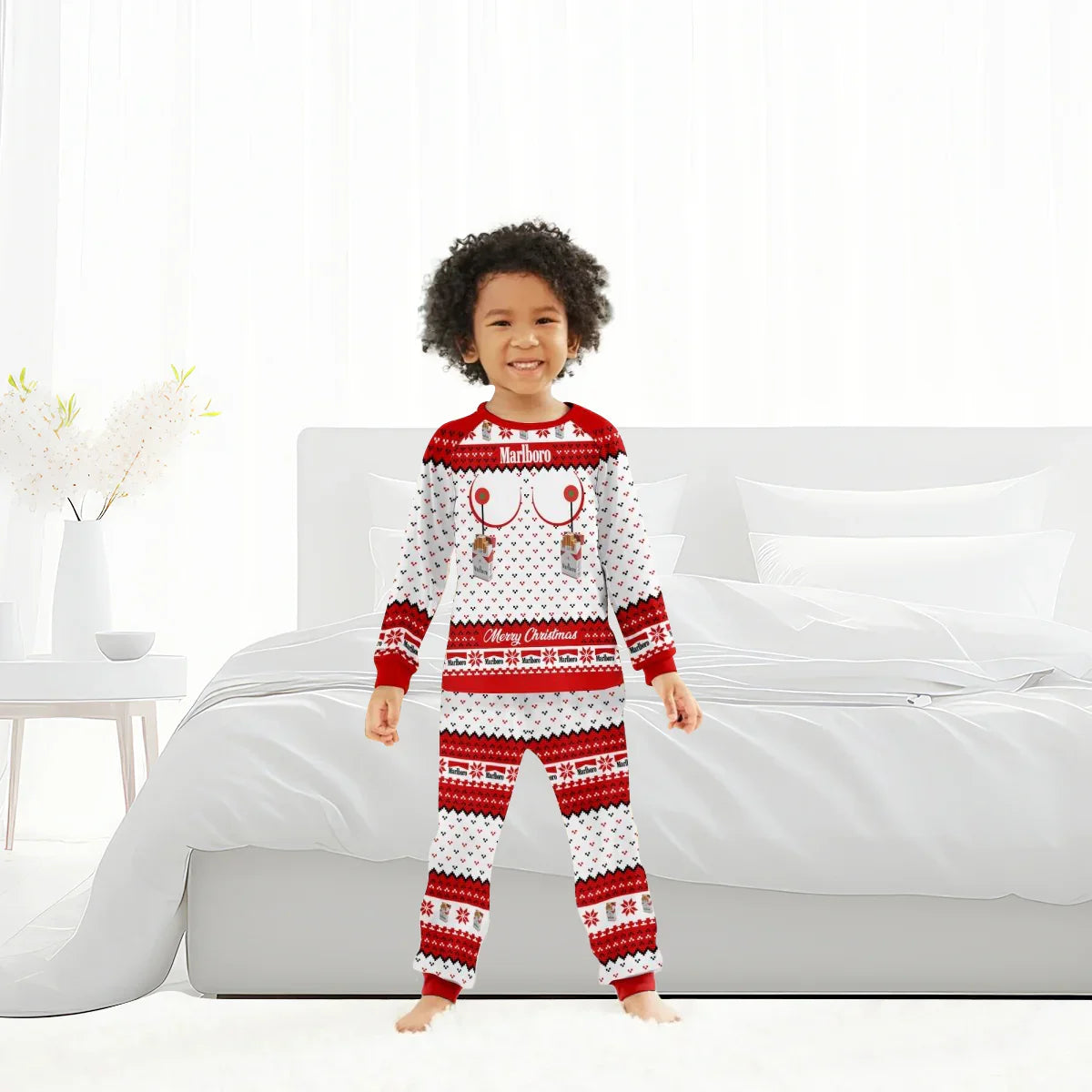 Smiling child wearing red and white Marlboro Merry Christmas family pajamas in bright bedroom