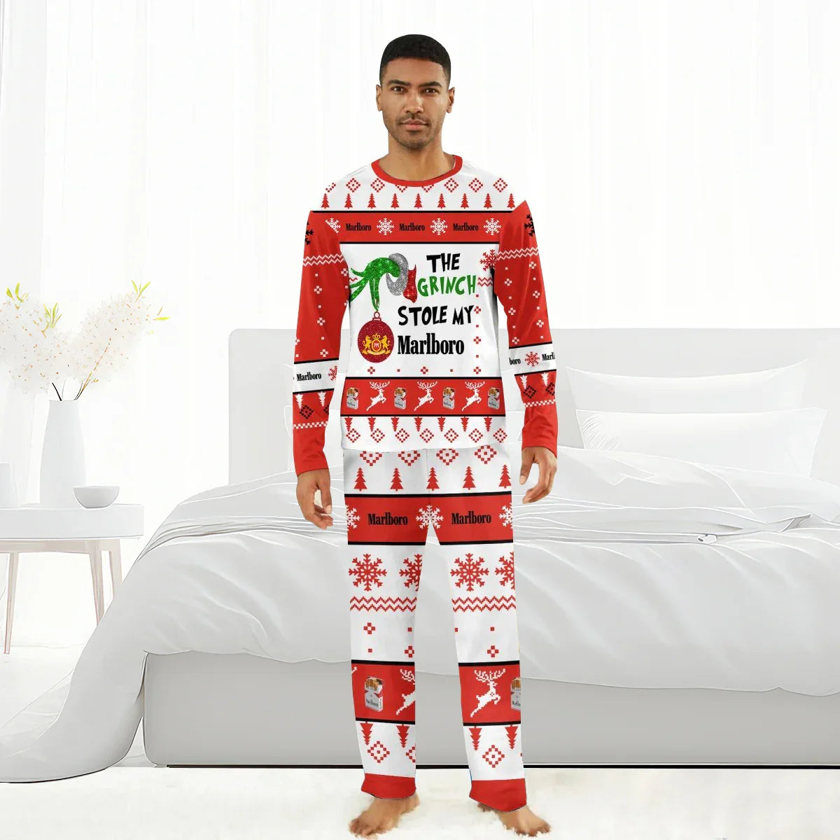 Man wearing red and white Christmas pajamas with Grinch and Marlboro designs in modern bedroom