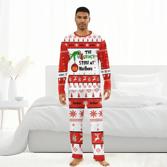 Man wearing red and white Christmas pajamas with Grinch and Marlboro designs in modern bedroom