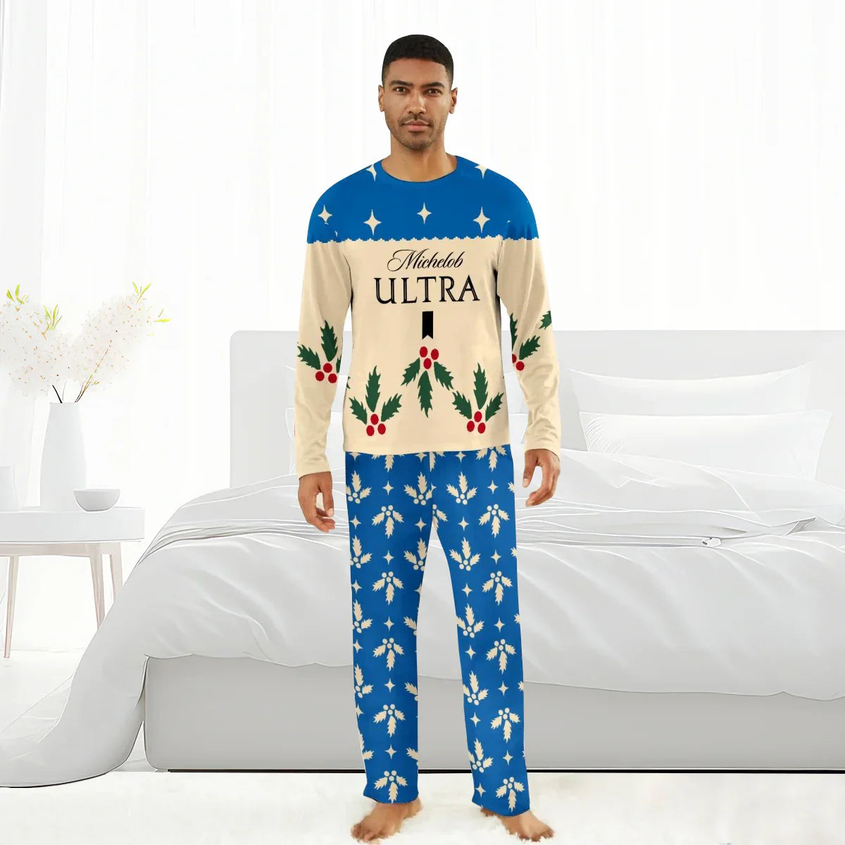 Man wearing Michelob Ultra Christmas pajamas with holly and blue star pattern in modern bedroom