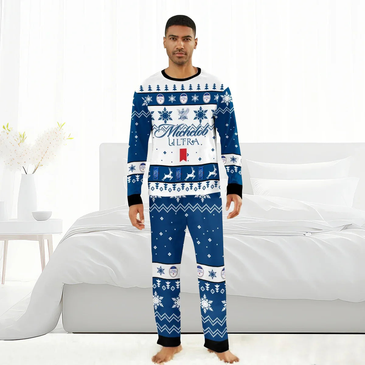 Man wearing blue and white Michelob Ultra Christmas-themed pajamas with reindeer and snowflake patterns