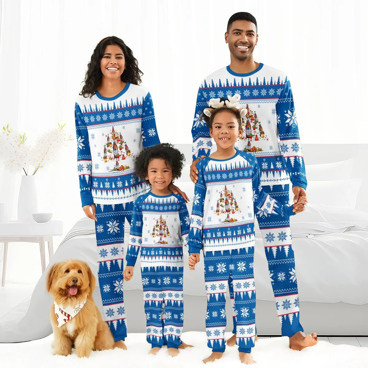 Family of four wearing matching blue and white Christmas tree pajamas with snowflake patterns in a bright living room