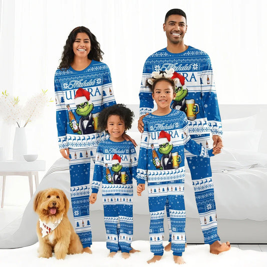 Happy family of four and dog wearing matching blue Michelob Ultra Grinch Christmas pajamas in bright bedroom