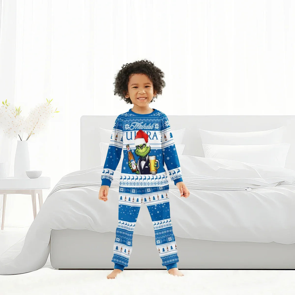 Child in blue Michelob Ultra Grinch Christmas pajama set with holiday pattern in bright bedroom
