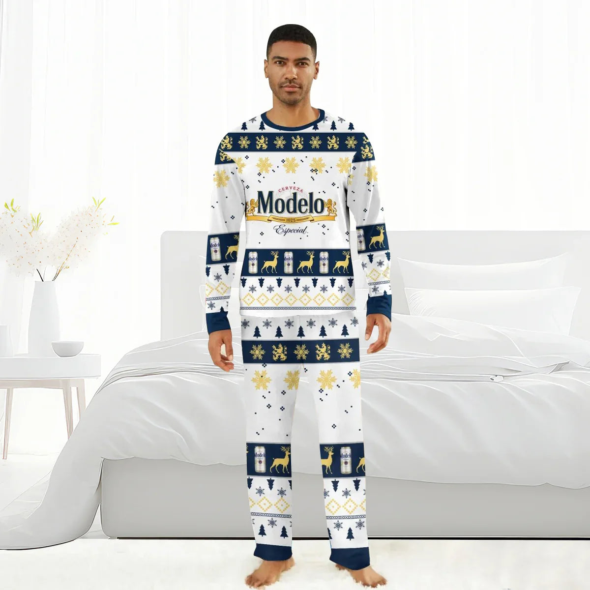 Man wearing Modelo Especial themed Christmas holiday pajamas with snowflakes and deer in white bedroom