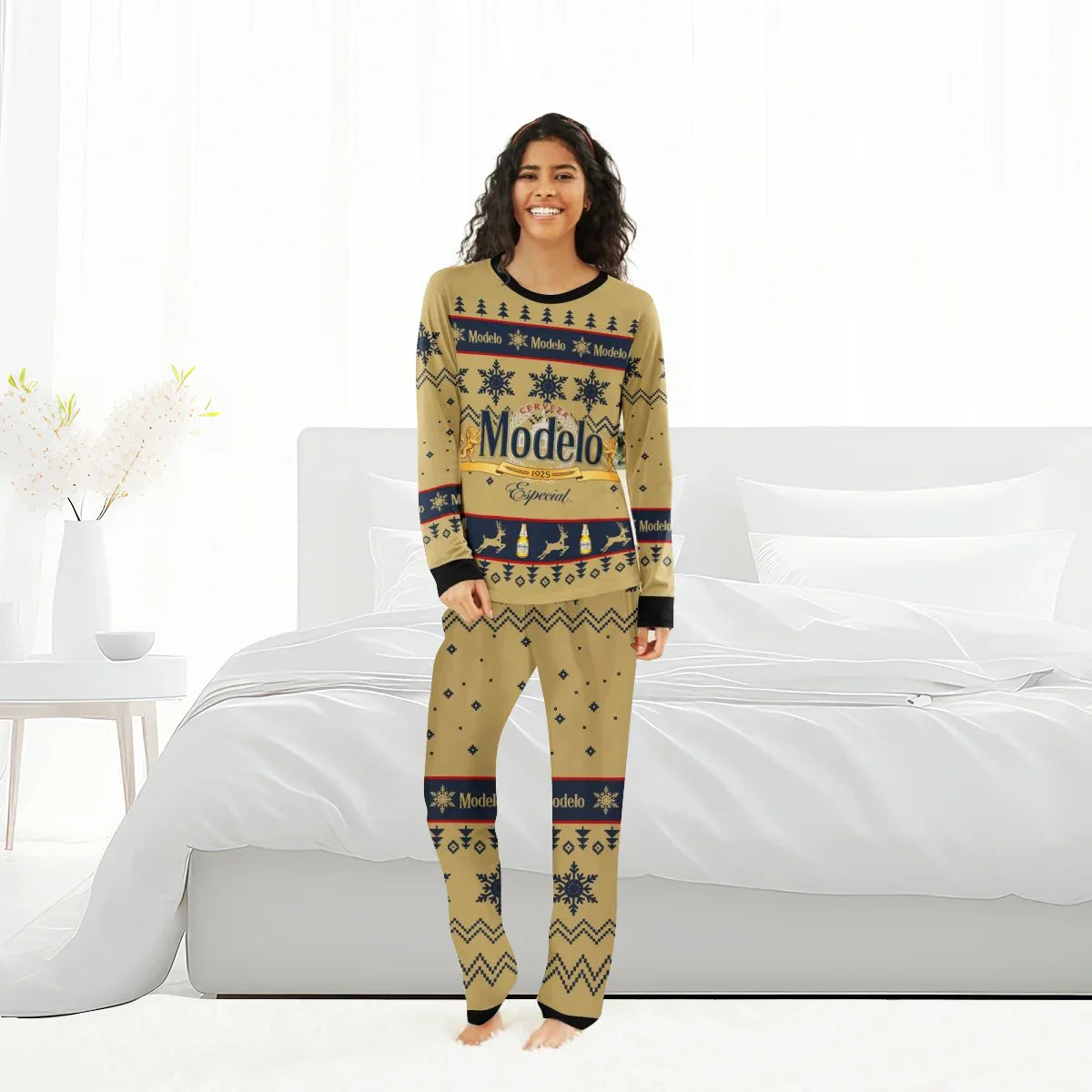Woman in Modelo Especial Christmas-themed beige pajamas standing in a bright white bedroom