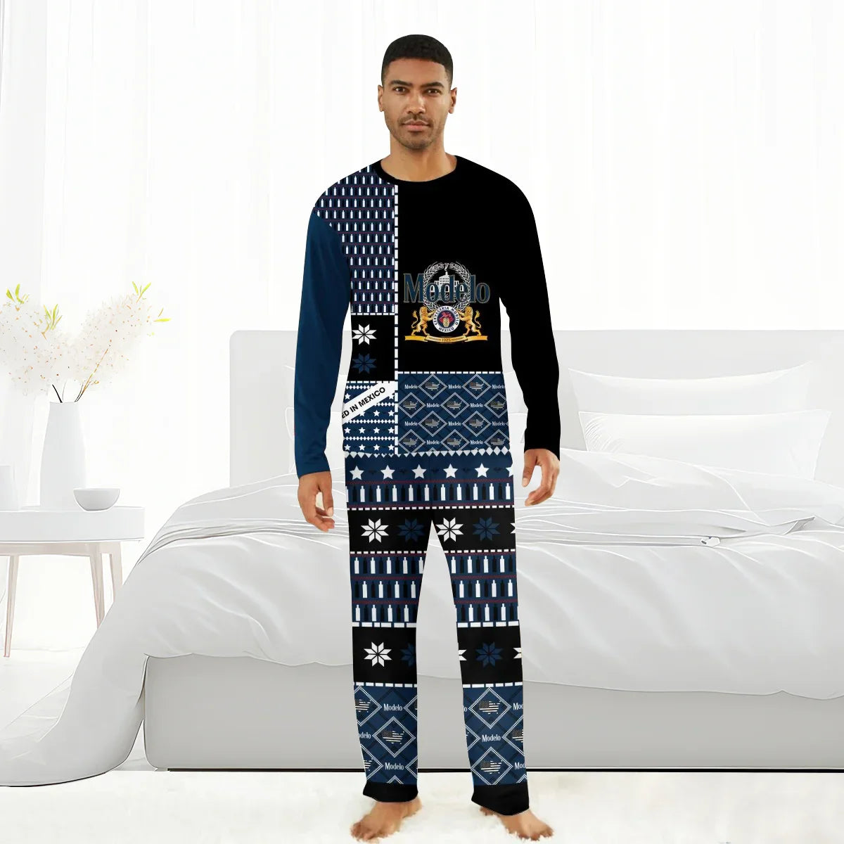 Man wearing black and blue Modelo branded family pajama set with logo and patterned design