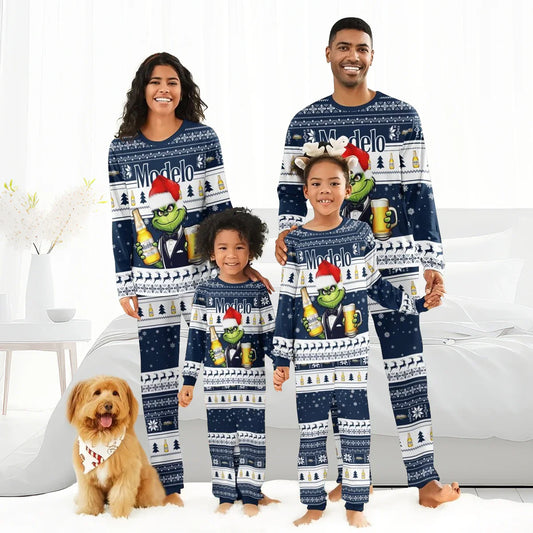 Happy family in matching navy Modelo Grinch Christmas pajamas standing in bright bedroom with dog