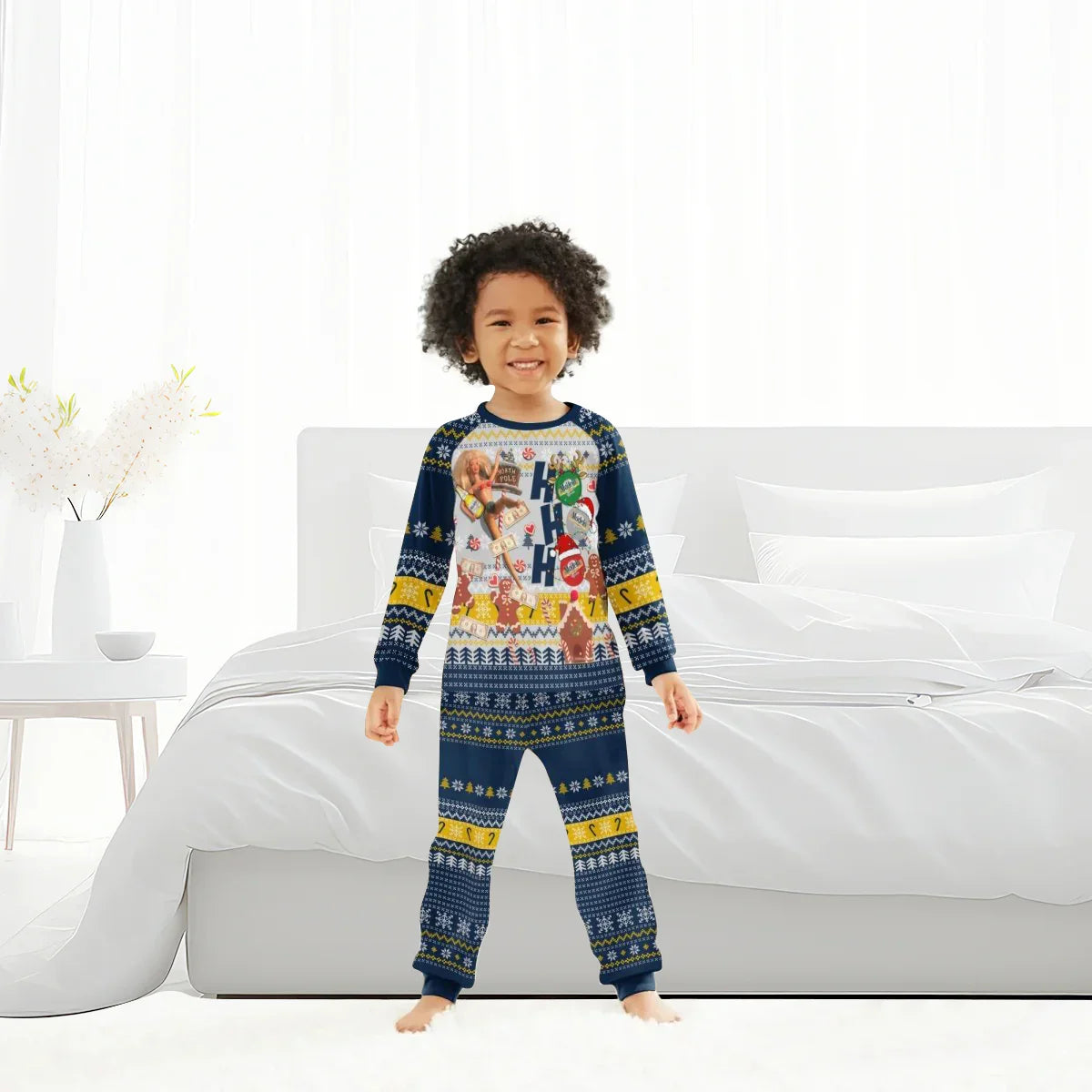Smiling child wearing navy blue holiday-themed pajamas with snowflakes and festive patterns in bright bedroom