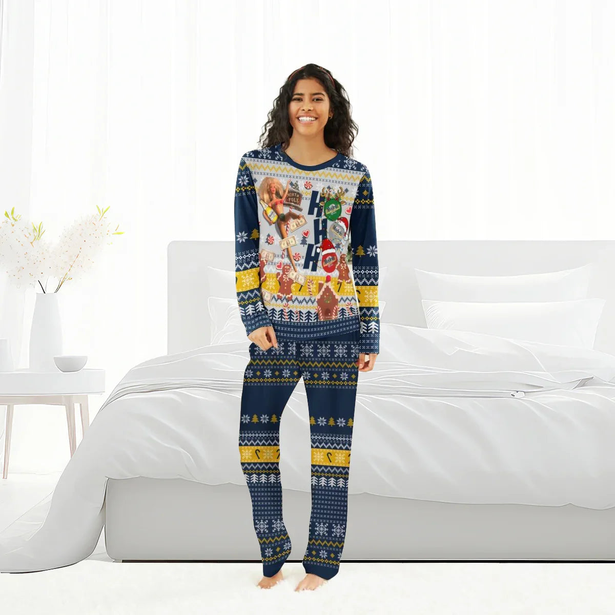 Woman wearing navy blue holiday-themed Christmas pajamas with festive Ho Ho Ho and candy designs