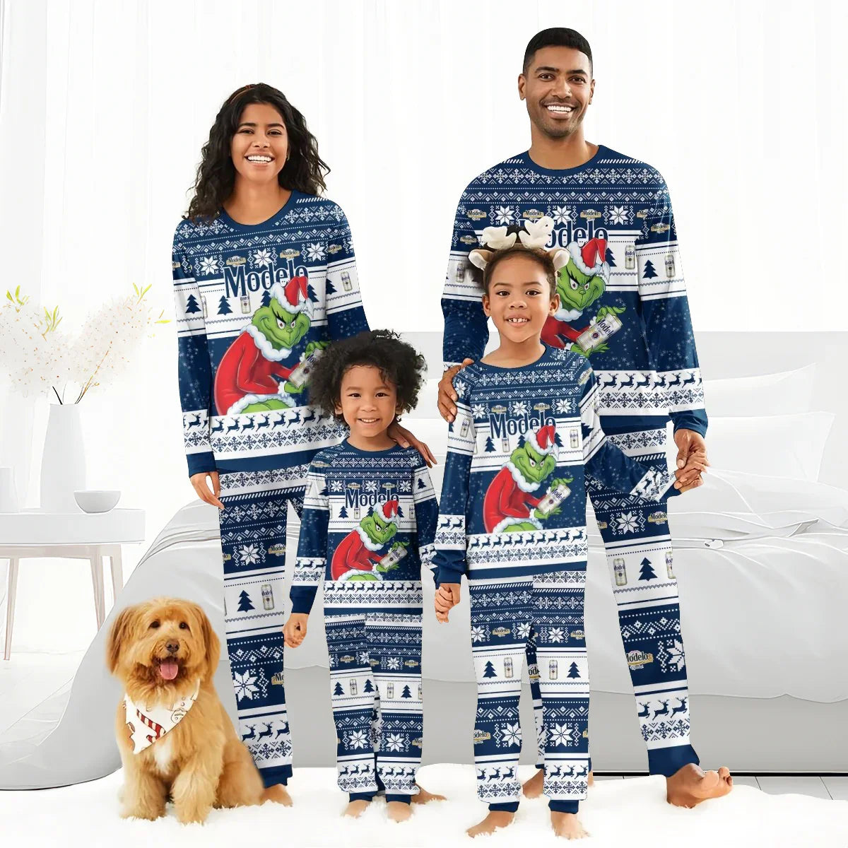 Smiling family wearing matching blue Modelo Santa Grinch holiday pajamas with Christmas patterns and dog with festive bandana